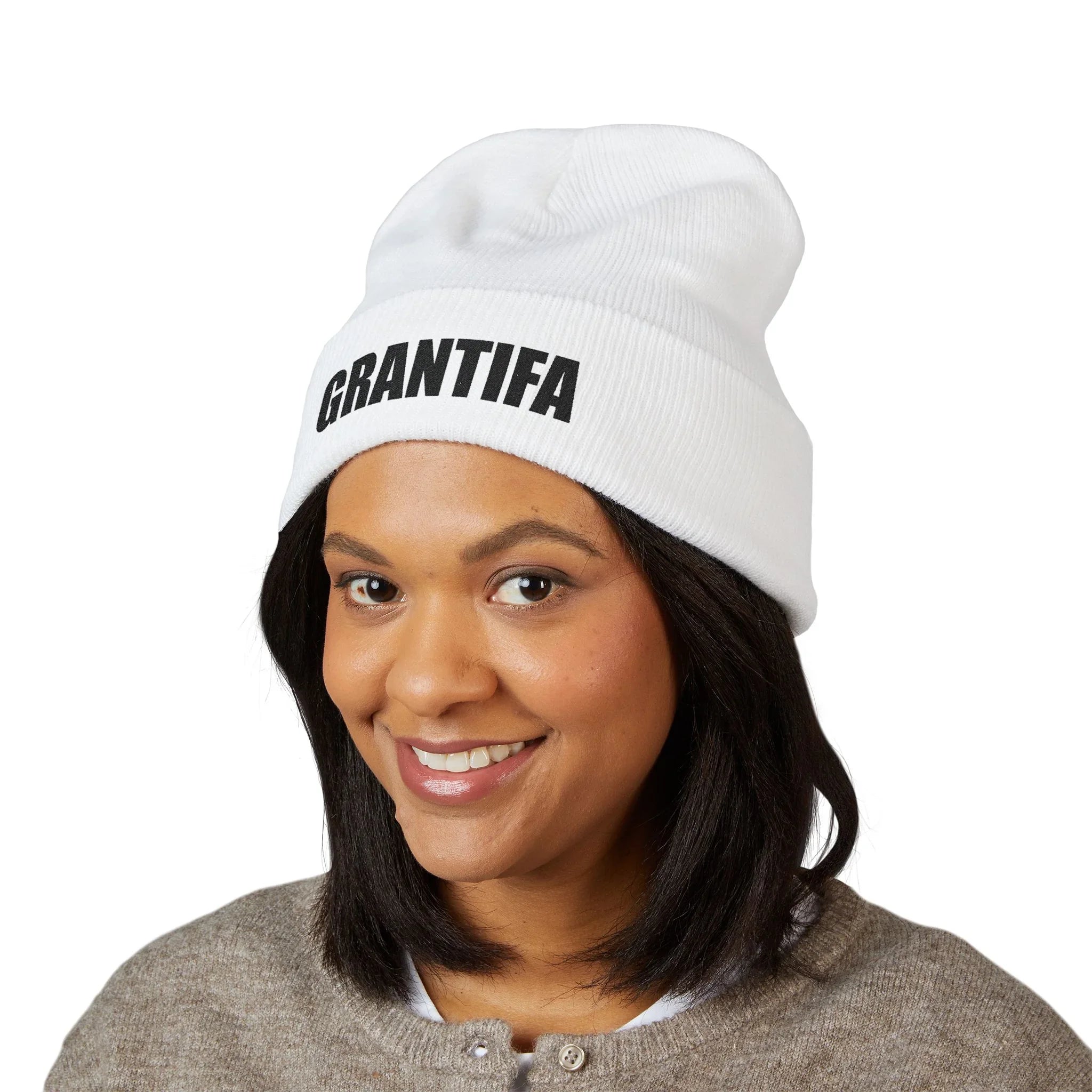Woman wearing a white beanie with bold GRANTIFA protest message in black text