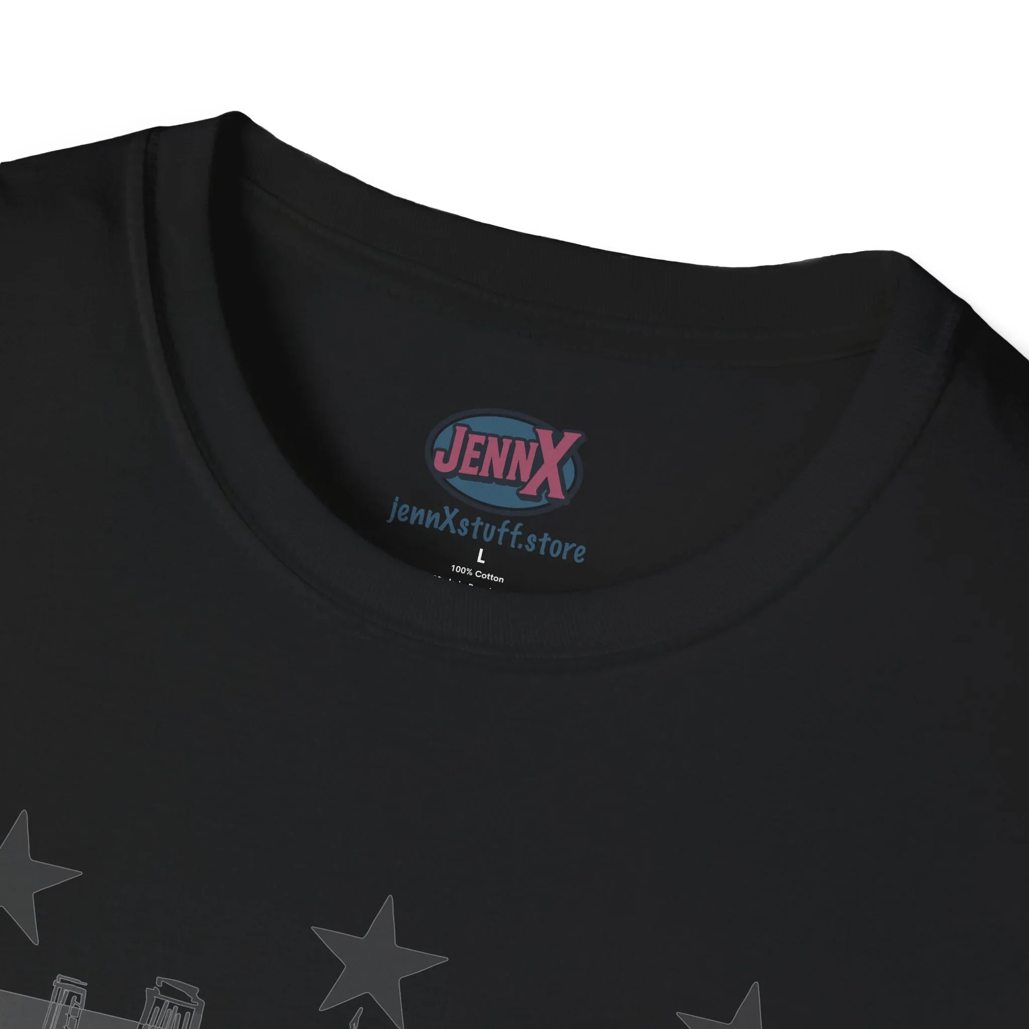 Close-up of black protest graphic tee collar with bold stars and artist-designed label