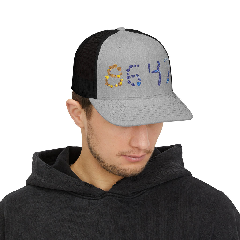 Man wearing 8647 Anti-Trump protest hat
