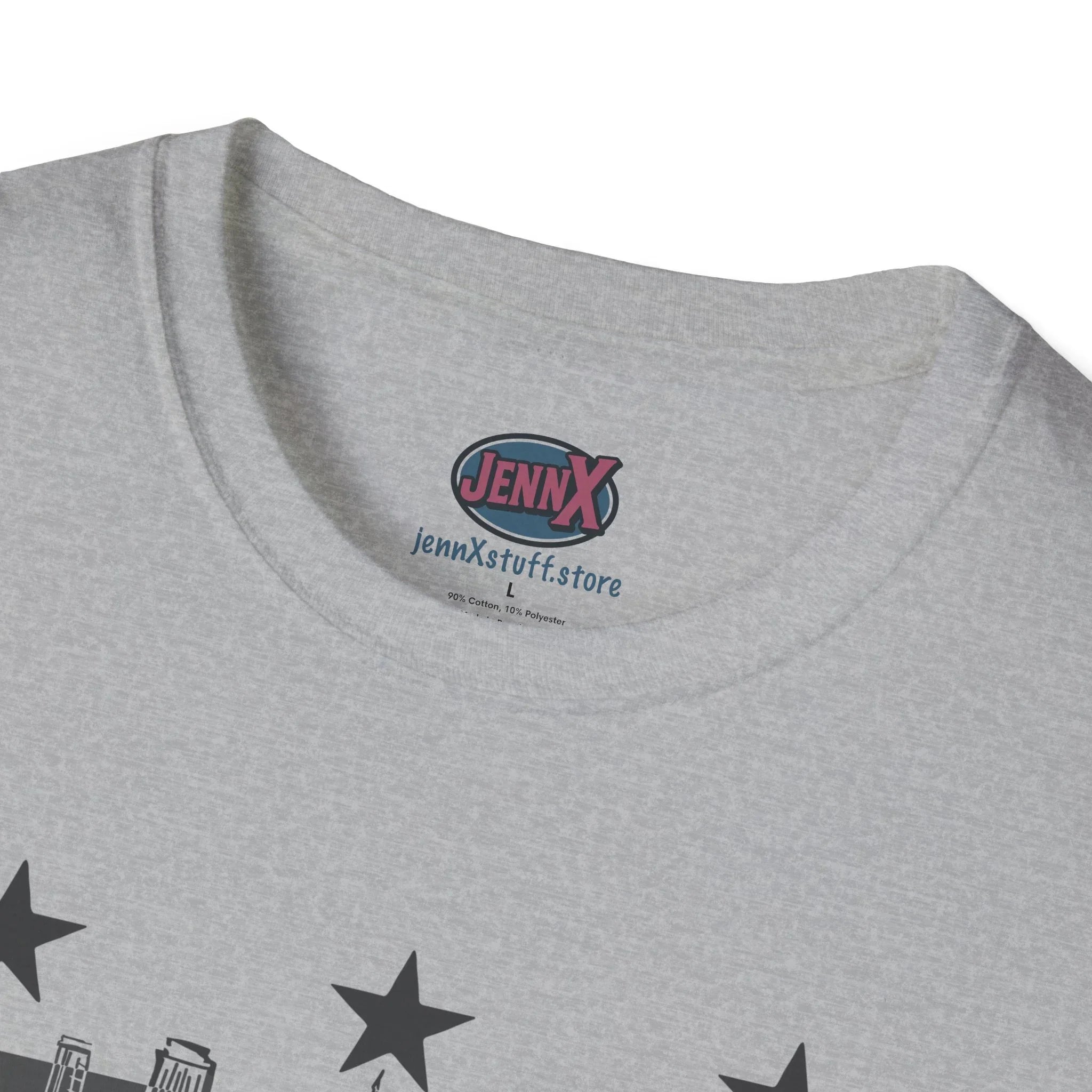 Close-up of protest graphic tee neckline with stars and bold activist design on light gray fabric
