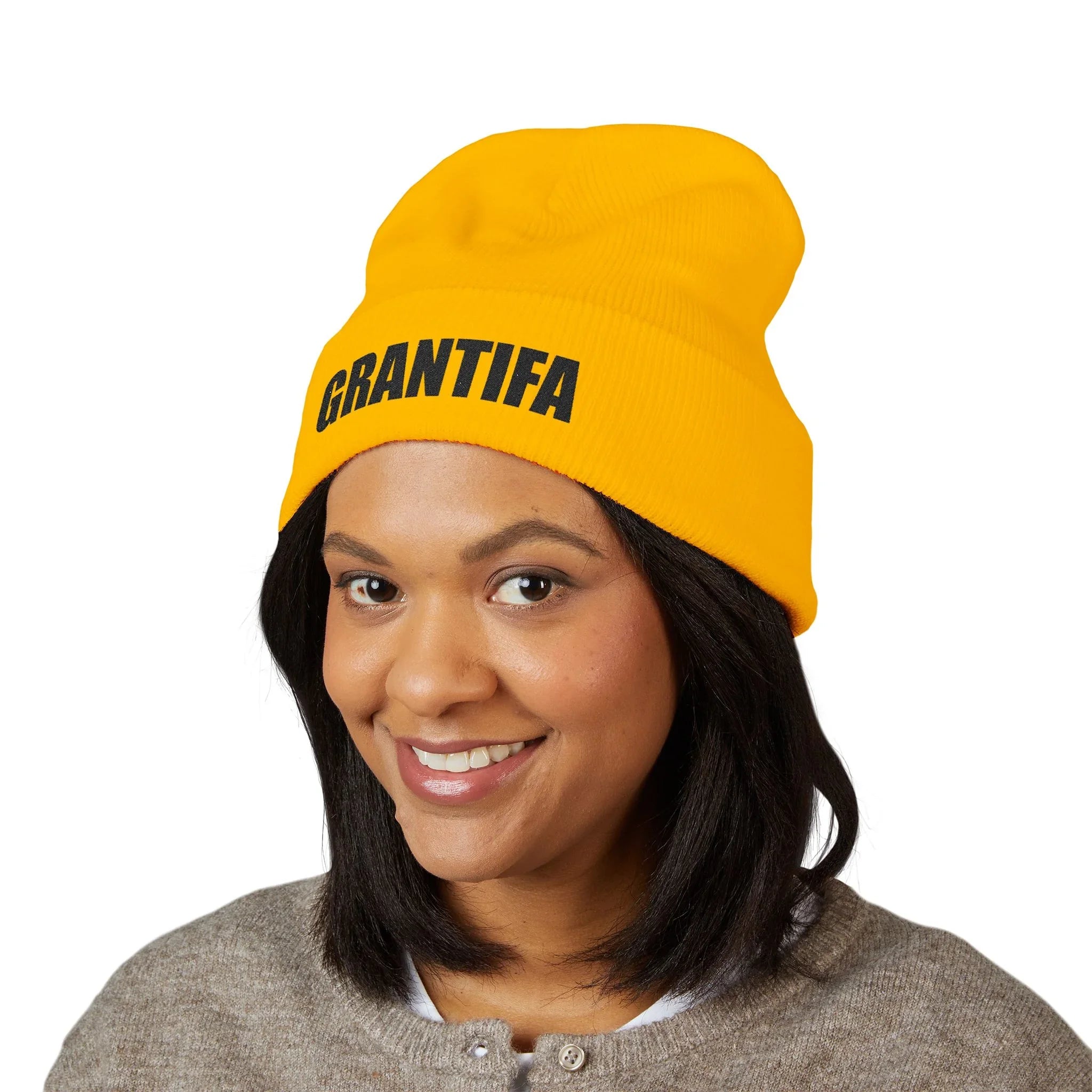 Woman wearing yellow GRANTIFA beanie, protest apparel, activist fashion accessory