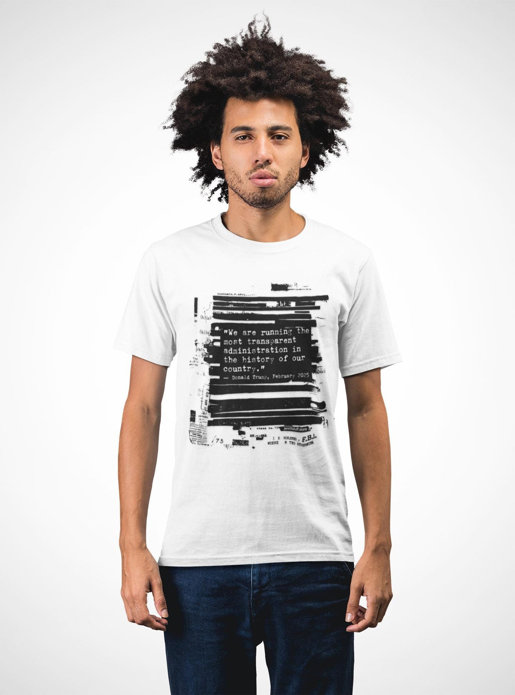 May include: White t-shirt with a black graphic print. The graphic includes the text "We are running the most transparent administration in the history of our country." and "Donald Trump, February 2015."