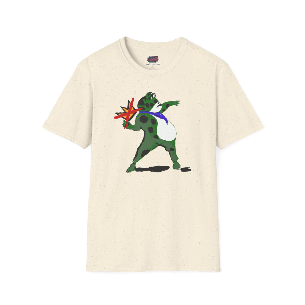 May include: Cream-colored t-shirt featuring a cartoon frog with green spots, a blue tie, and a white belly. The frog is throwing a red and yellow star-shaped object. The shirt has a crew neck and short sleeves.