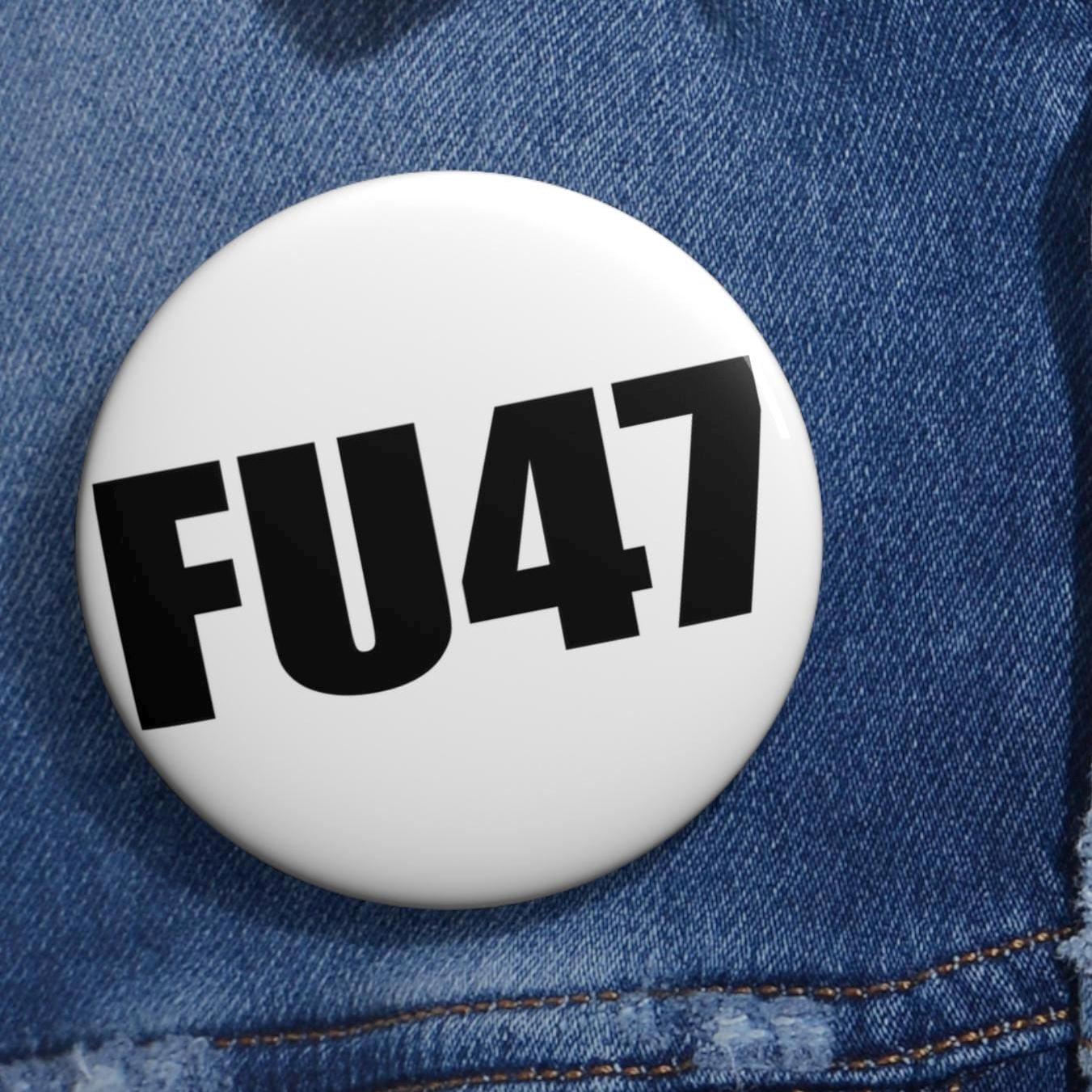 May include: A white button with the black text "FU47" centered on the front. The button is set against a blue denim background.